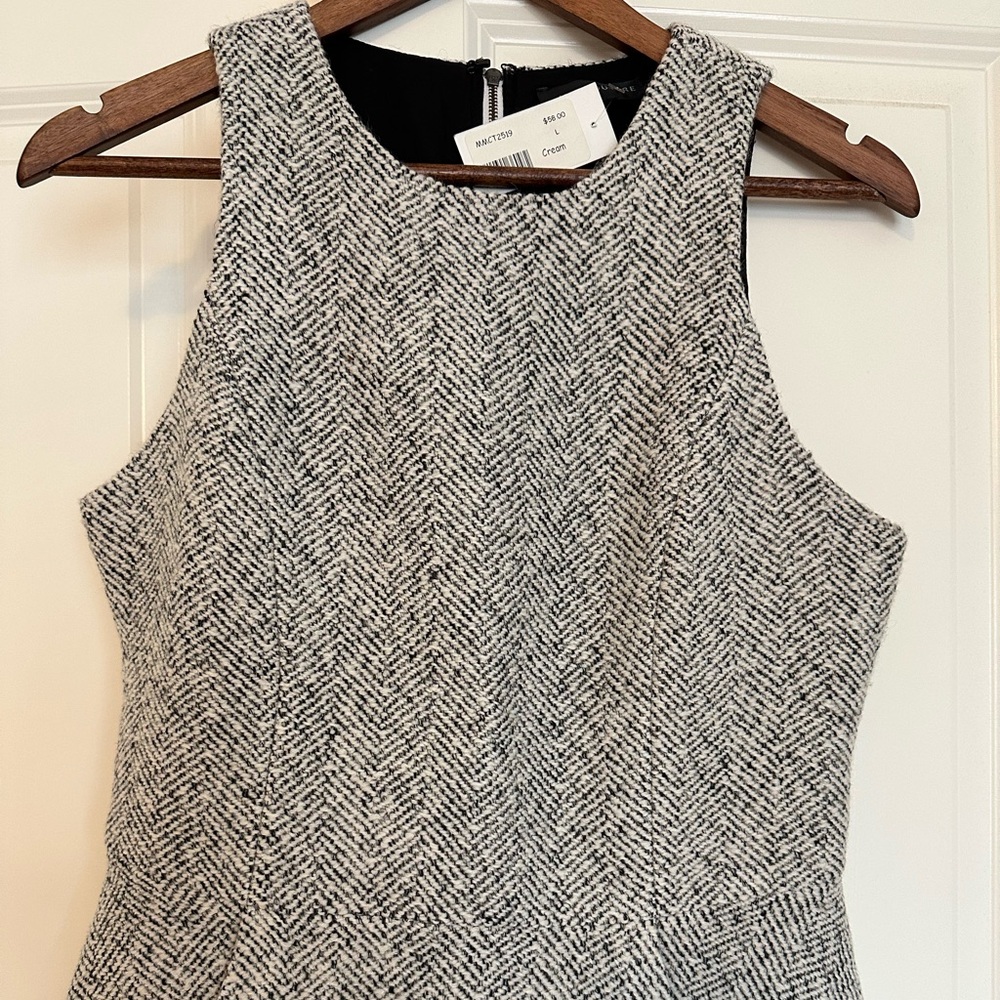 Plaid Sleeveless pleated top. Size L. Zipper back closure. New with tags.
